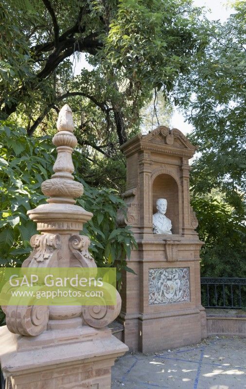The Glorieta de Mas y Prats is a monument to the poet Benito Mas y Prats. A brick monument with a bust. Parque de Maria Luisa, Seville, Spain. September