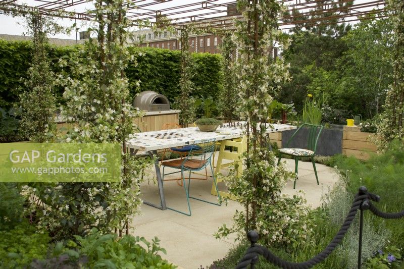 RHS Chelsea Flower Show 2023 - Trellis over the dining area in the London Square Community Garden designed by James Smith