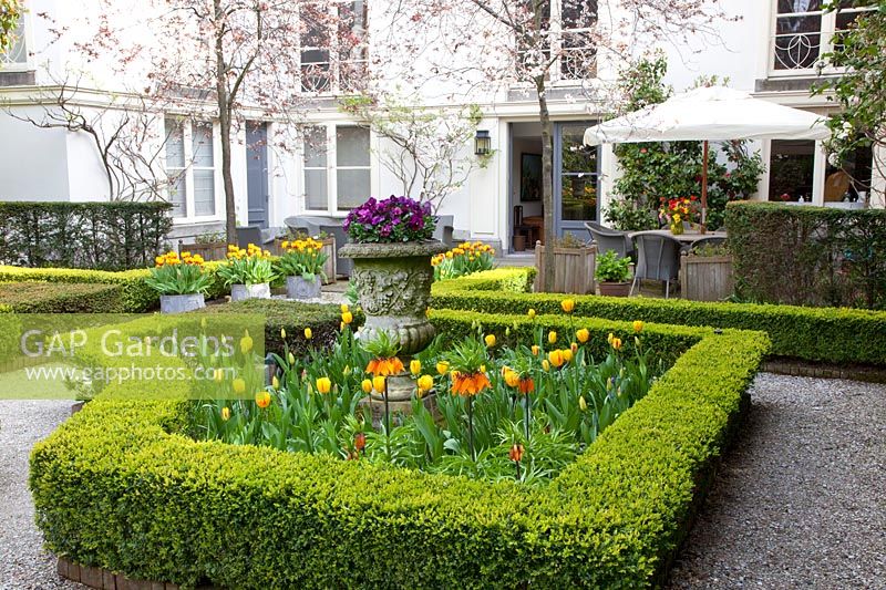 Formal garden with seating area 