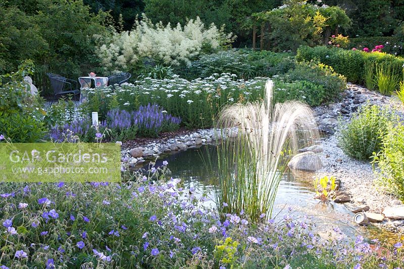 Pond with fountain and seating area 