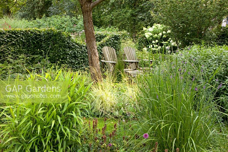 Natural garden with seating area and grasses 