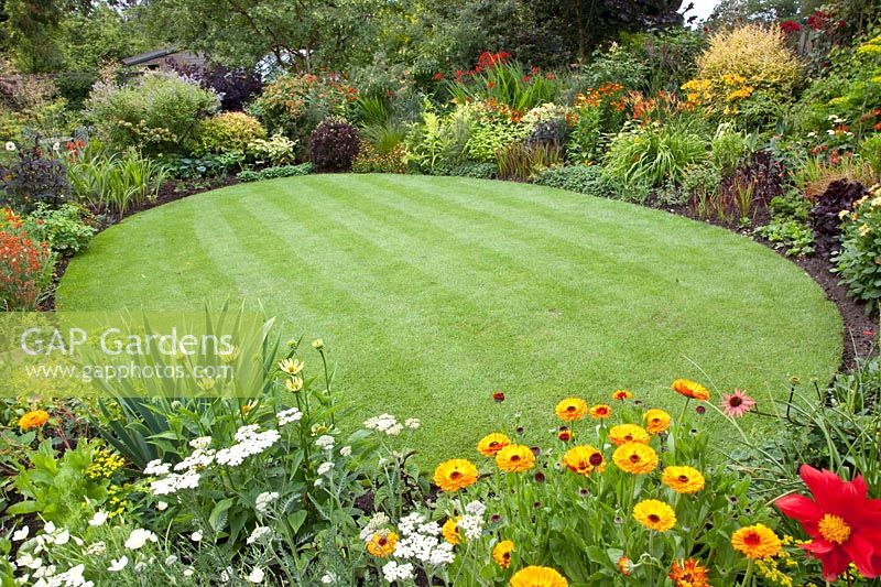 Circular lawn lined with flowerbeds 