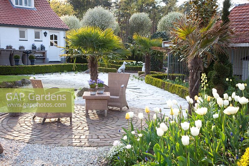 Seating area with Tulipa Maja, Tulipa Verona, Tulipa Francoise, Tulipa Ivory Floradale, Fritillaria persica Ivory Bells 