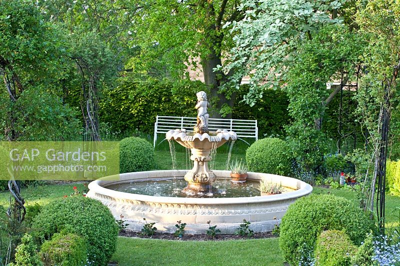 Formal garden with fountain, Sorbus aria, Tilia cordata 