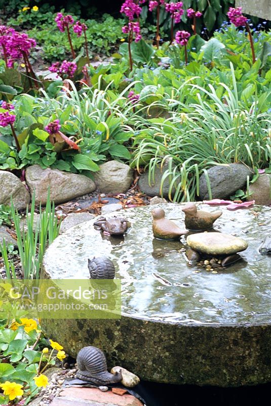 Small pond with millstone 