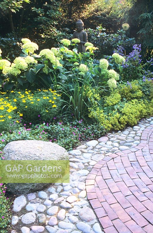 Path made of paving mix and flowerbed 