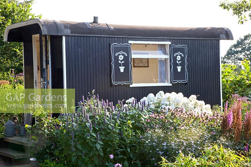 Old trailer as a garden house 