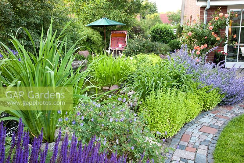 Seating area by the pond with beach chair 