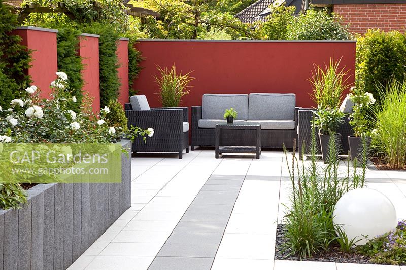 Modern garden with seating area and wall panels 