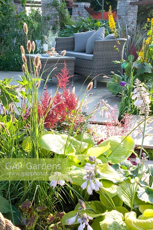 Seating terrace, Astilbe, Hosta, Ligularia 