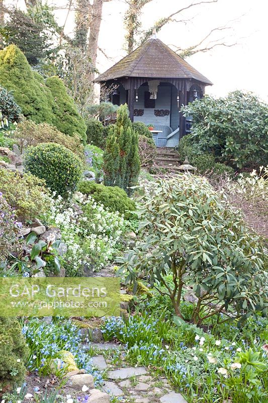 Path to pavilion in hillside garden 