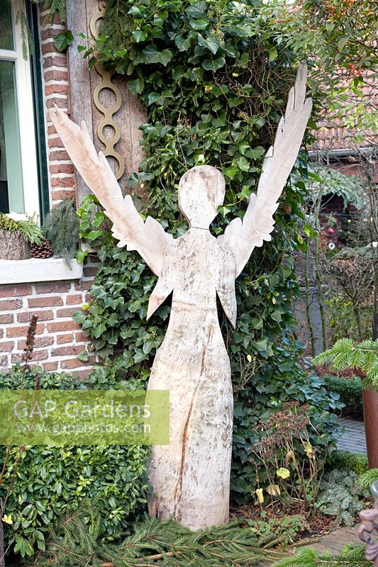 Winter decoration with wooden angel 