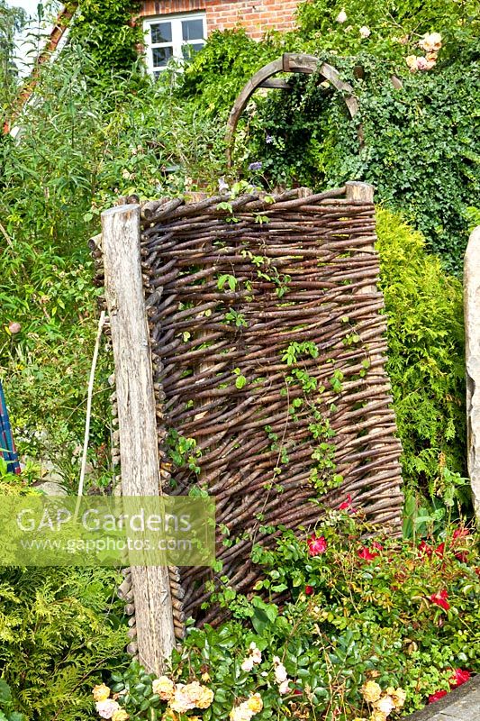 Front garden with wicker fence 