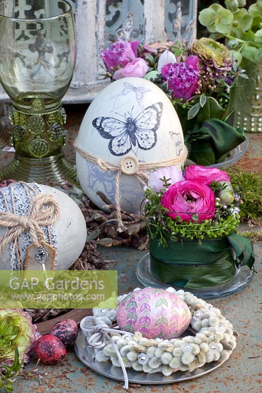 Easter decoration in vintage style, arrangement of ranunculus, willow wreath 