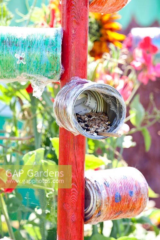 Bird feeding station made from tin cans 