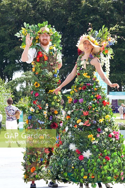 Stilt walkers at a flower show 