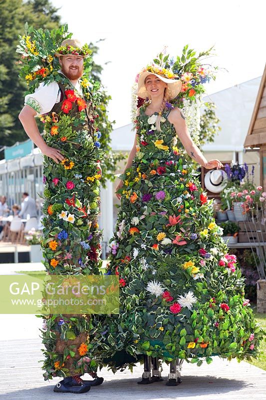 Stilt walkers at a flower show 