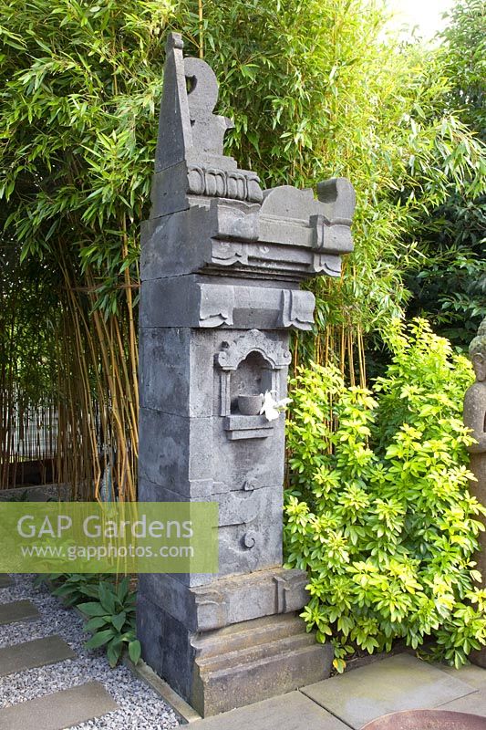 Detail Balinese temple gate made of lava stone 