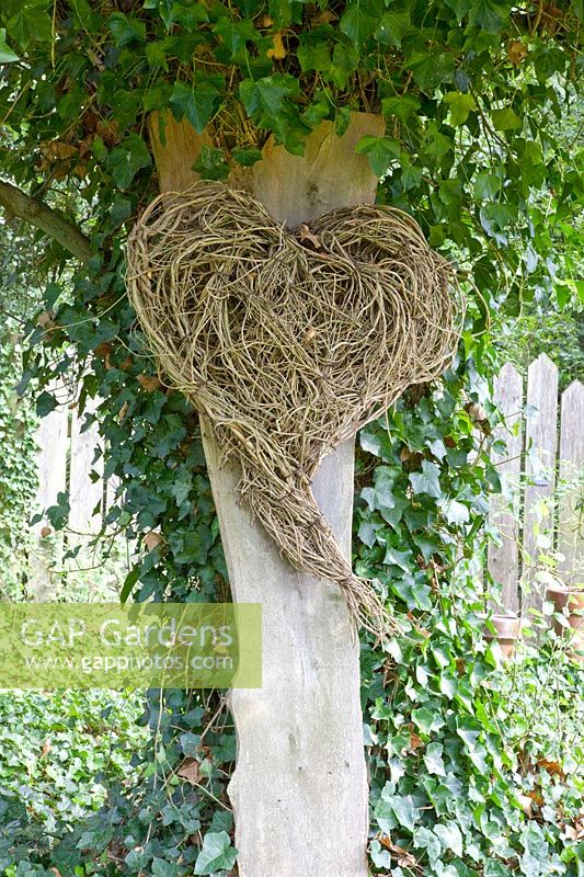 Heart made of branches as garden decoration 
