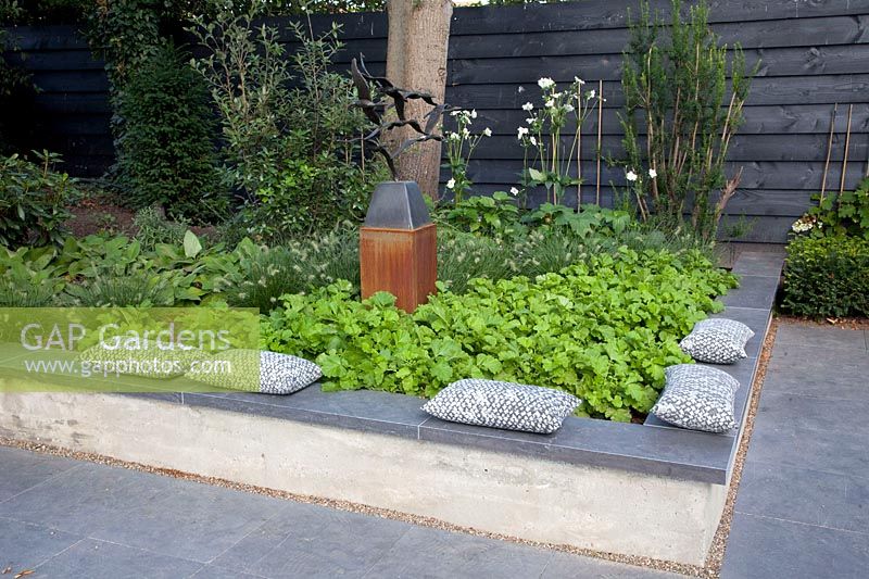 Brick bed edging that also serves as a seating area 