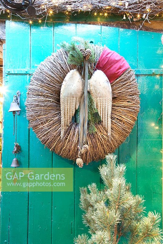 Christmas decoration, wreath with angel wings made of metal 