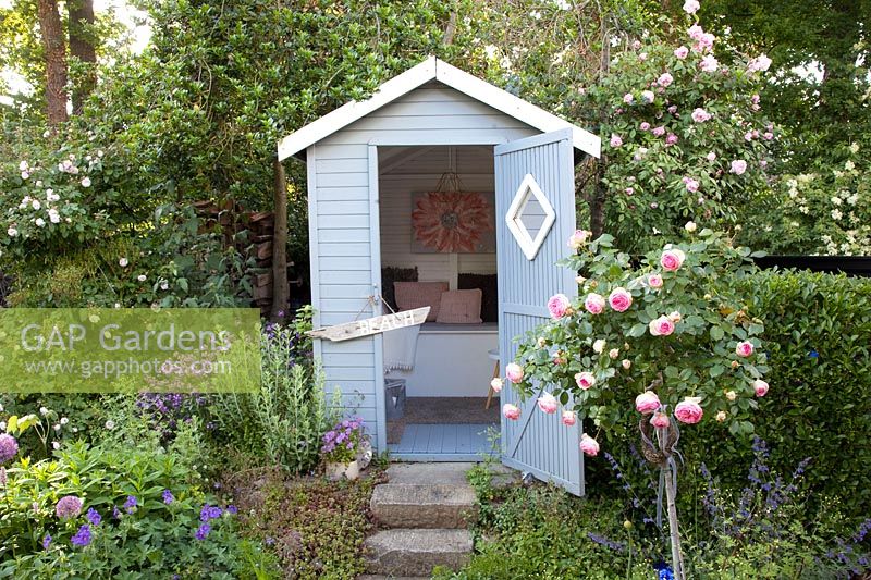 Garden with beach hut, Rosa Eden Rose; Rosa Mortimer Sackler, Rosa Blush Noisette 