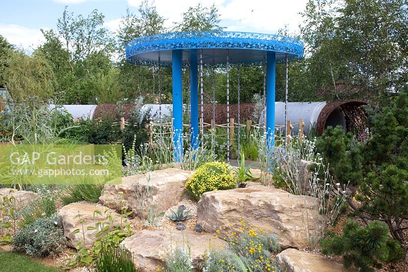 Modern garden with rocks and drought-resistant plants 