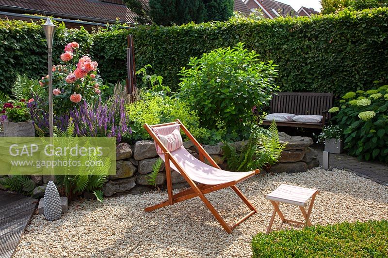 Deck chair in small garden 