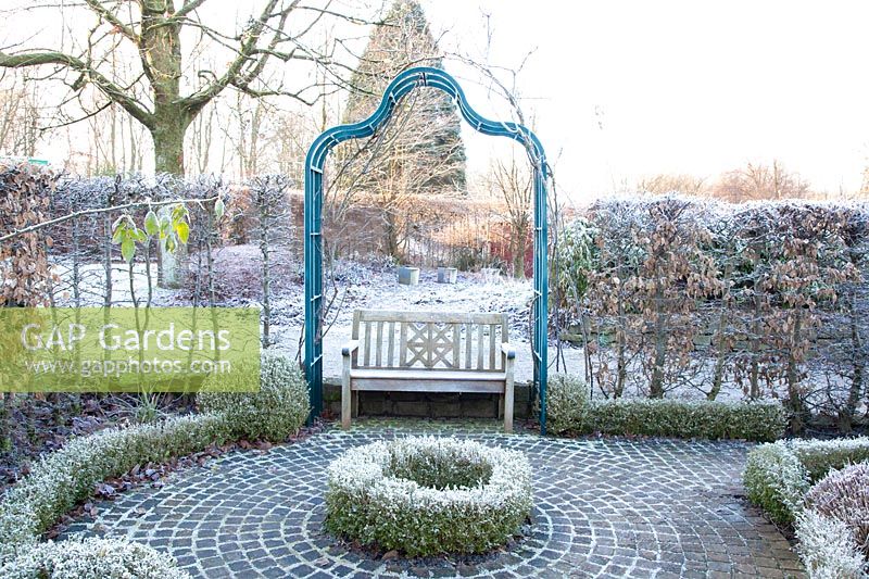 Seating under rose arch 