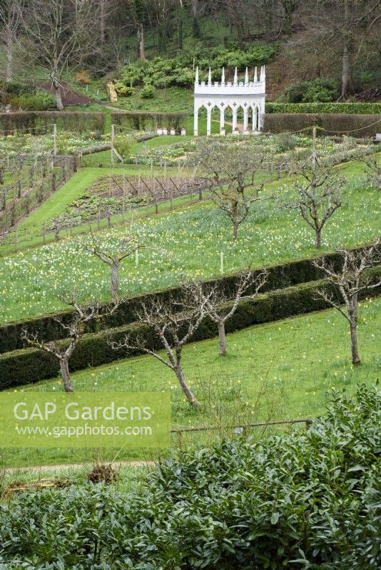 View down onto the geometric kitchen garden and the Exedra at Painswick Rococo Garden in Gloucestershire in March