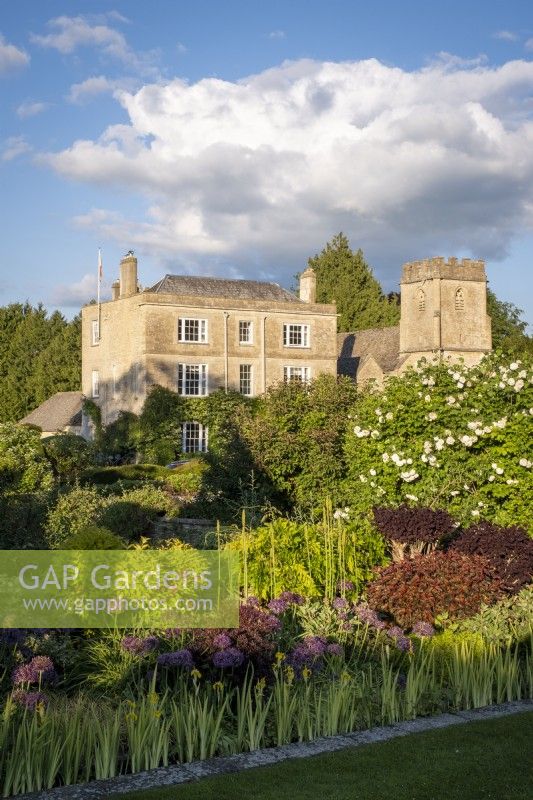 View towards Daglinworth House, Gloucestershire across the formal gardens