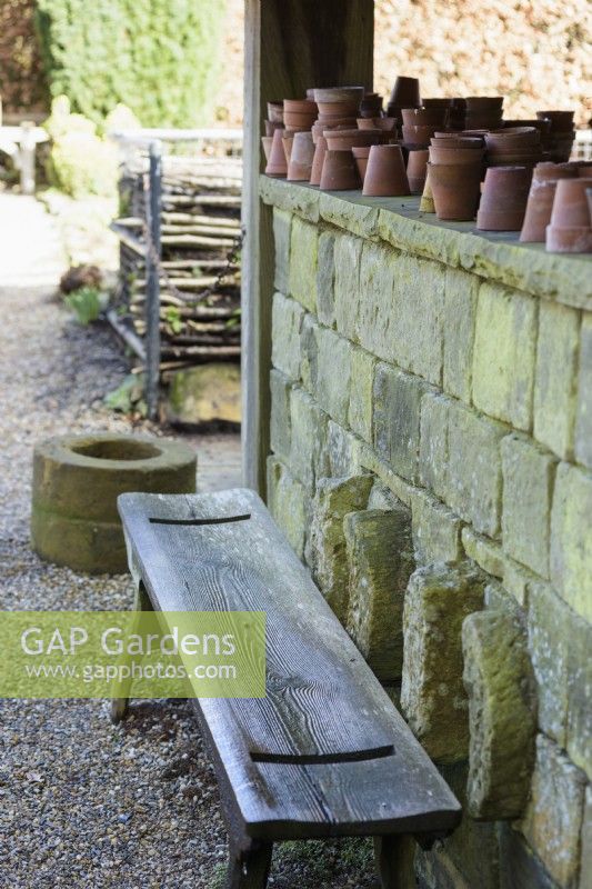 Wooden bench at York Gate Garden in February