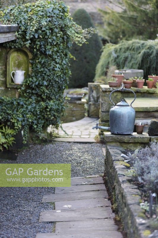 Metal kettle in York Gate Garden in February