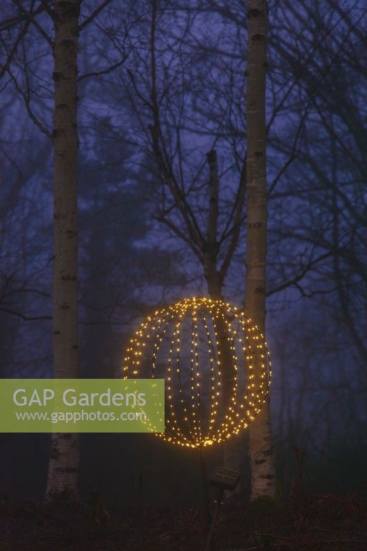 Spherical garden light at night