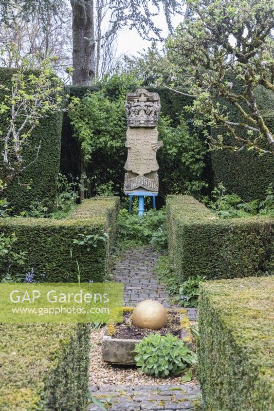 Crown and coat of arms with low hedges of clipped Yew. April. Spring. 