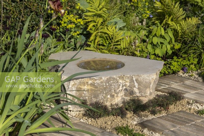 Stone water feature - 'It Doesn't Have to Cost the Earth' - designer Michael Lote - RHS Malvern Spring Festival 2024