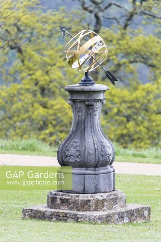 Armillary sphere on terrace lawn. May. Spring. 