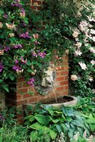 Lions Head water feature on wall in Sun House, Long Melford, Suffolk