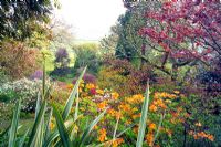 View across garden to Bristol Channel at Greencombe Gardens in Somerset
