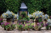 Containers with planting and fountain at The Grille Courtyard at Viana Place in Cordoba Spain