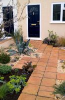 Suburban front garden with Terracotta paving and gravel at Capel Manor Show Gardens