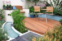 Chic compact small urban garden with decking
