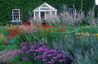Echinops ritro, Globe Thistle, Erigeron Adria, Veronicastrum virginicum Lavendelturm, Crocosmia Lucifer, Geranium Pink Delight at the Dell Garden, Bressingham.