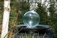 Allison Armour-Wilson's acrylic Aqualens - Acrylic ball water feature in Richard Ayres' Garden, Lode, Cambridgeshire 