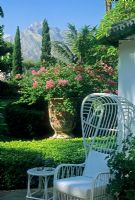 White chair and large planter with view of mountains behind - Santa Margarita, Marbella 