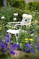 White chair with Paeonia 'Duchesse de Nemours', Aquilegia chrysantha 'Yellow Queen' and Achillea millefolium 'Hella Glashof' - The Daily Telegraph Garden,  Chelsea 2007