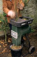 Using a quiet compost shredder to process woody prunings