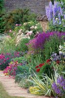 Rosa 'La ville de Bruxelles', Delphinium 'Blue Jade', Salvia x superba and Dianthus 'Laced Monarch - The Garden House, Gloucestershire