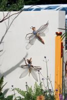 Ornamental Dragon flies on wall - Hampton Court 2007