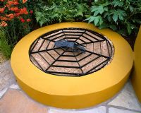 Raised childrens sandpit painted mustard yellow with metal spiders web grid over the top - Mercedes-Benz Garden, Tatton Park 2002